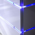Robas Lund 59057W11 TV-Lowboard Sonia, Hochglanz weiß, Klarglas, 3 Schubkästen, LED Effektbeleuchtung blau, B/T/H circa 110 x 42 x 44 cm